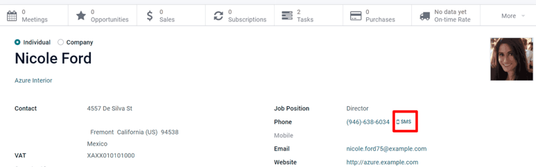 The SMS icon is located on an individual's contact form in Odoo Contacts.
